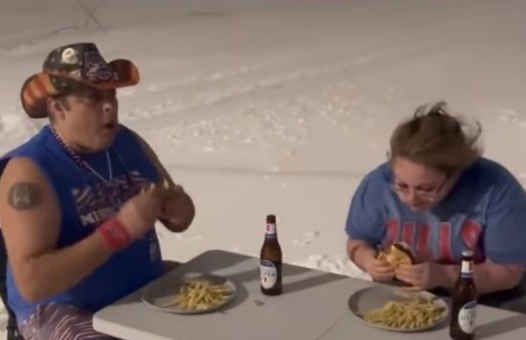 Buffalo Bills Fans eating at table during snowstorm