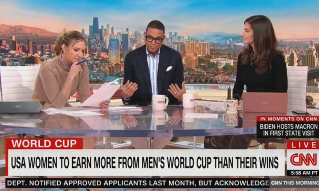 Don Lemon on set sitting at desk with two other women
