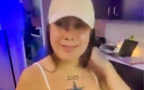 Female Cowboys fan with tattoo on chest