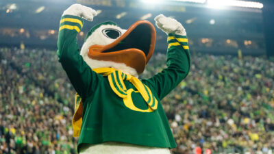 Oregon Ducks maskot Puddles hyping up the crowd during football game
