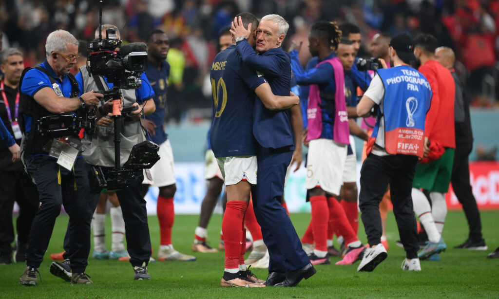 France coach Didier Deschamps embraces forward Kylian Mbappe