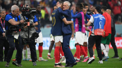 France coach Didier Deschamps embraces forward Kylian Mbappe