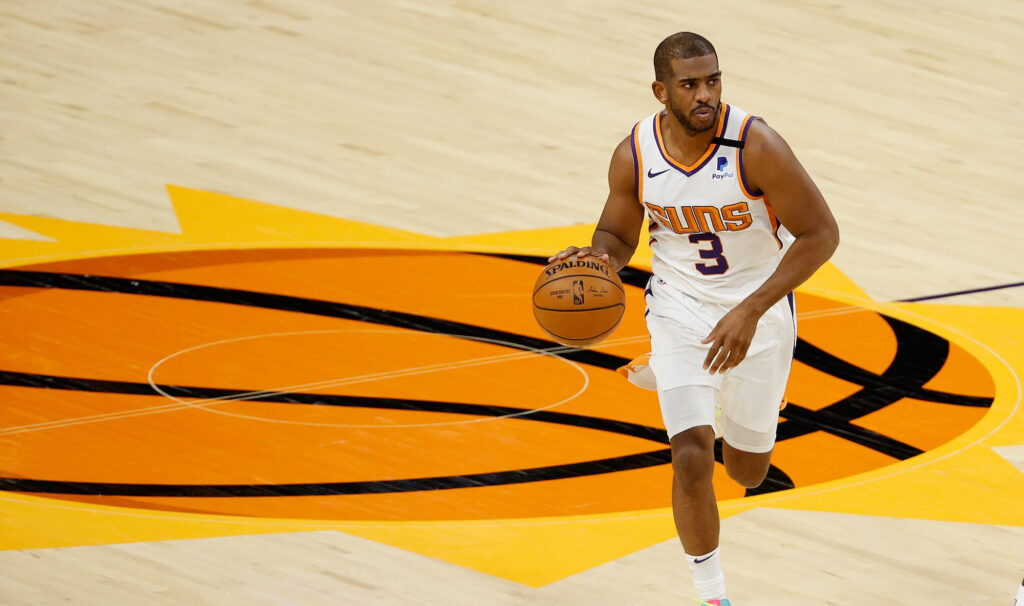 Chris Paul dribbles the ball up the court in Phoenix.