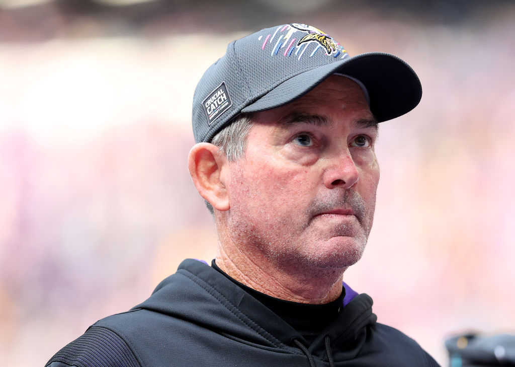Mike Zimmer with a Vikings cap on