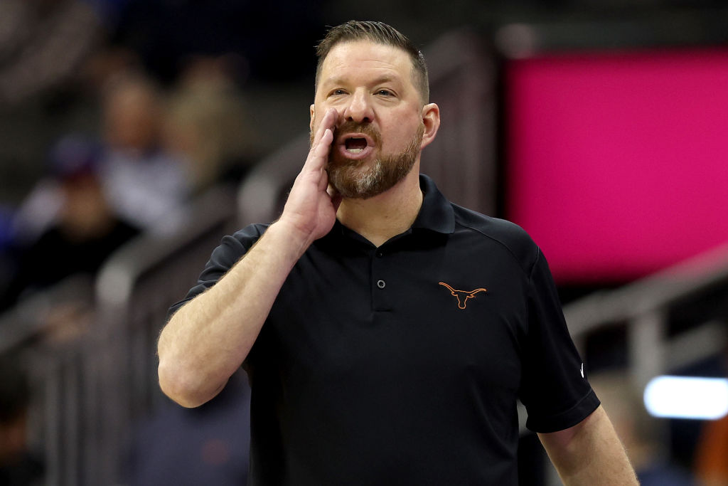 Chris Beard yelling at players while in Texas longhorns shirt