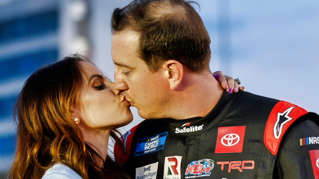 Kyle Busch and wife kiss.