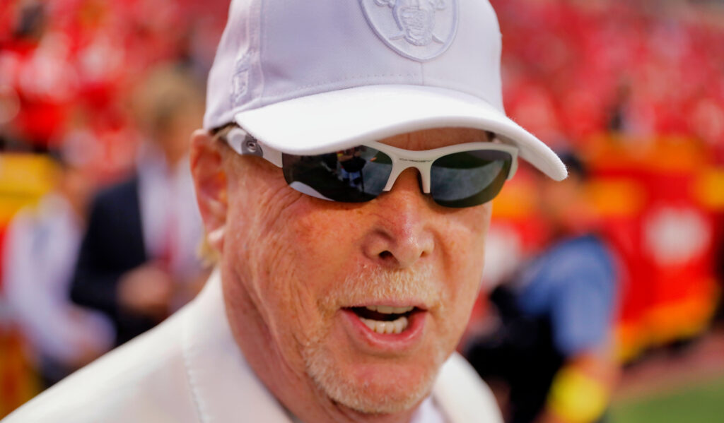 Mark Davis in a white Raiders cap and sunglasses