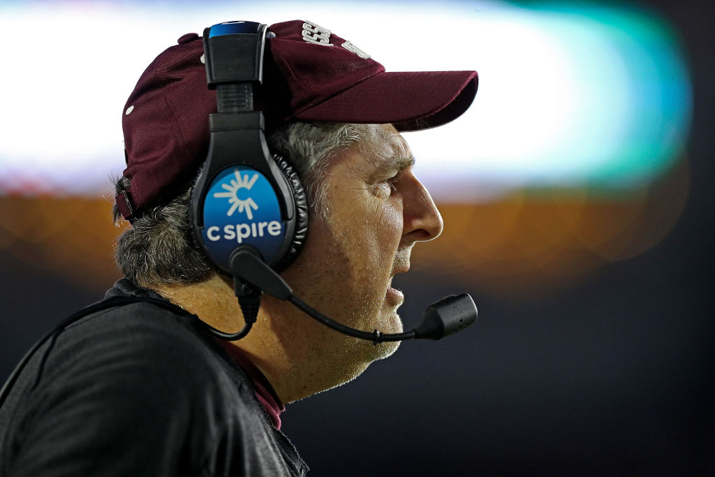 Mike Leach with a headset on