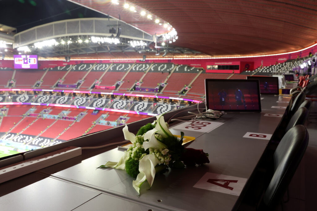 Flowers placed in memory of World Cup reporter Grant Wahl following his passing