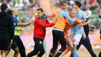goalkeeper Tom Glover being taken off soccer pitch after getting hit in the face