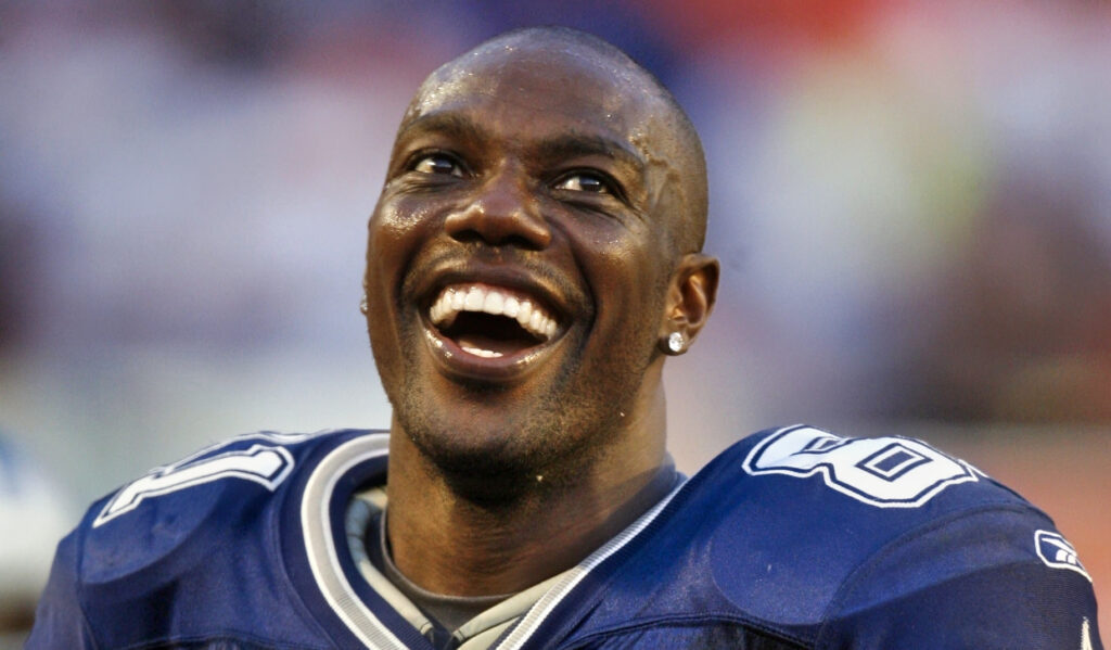 Terrell Owens smiling in cowboys jersey.