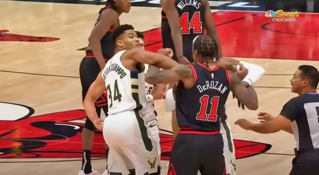 DeMar DeRozan held back by Giannis during scuffle on court