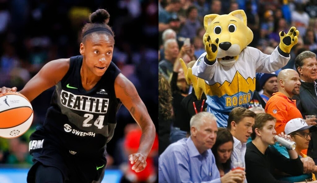 Jewell Loyd dribbling basketball while Rocky the mascot is in the crowd with fans