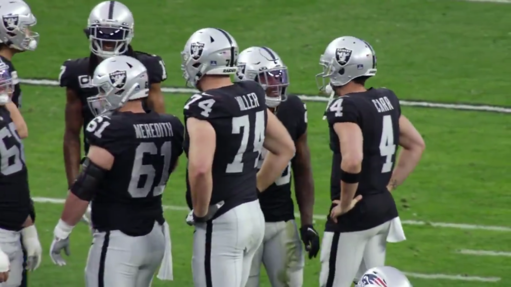 Las Vegas Raiders players in the huddle