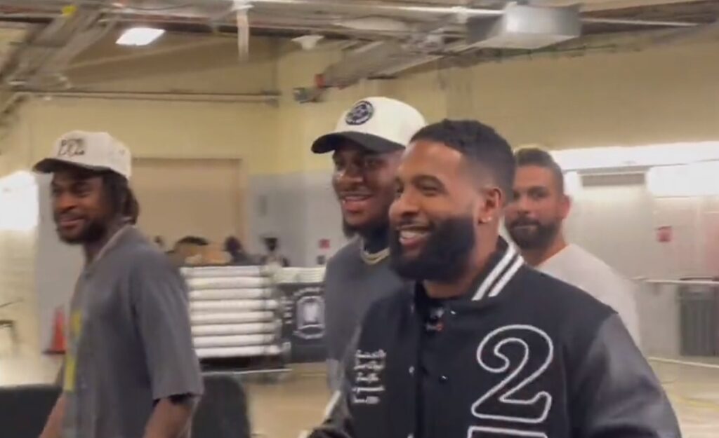 Odell Beckham Jr. walking with Micah Parsons and other players from the Cowboys