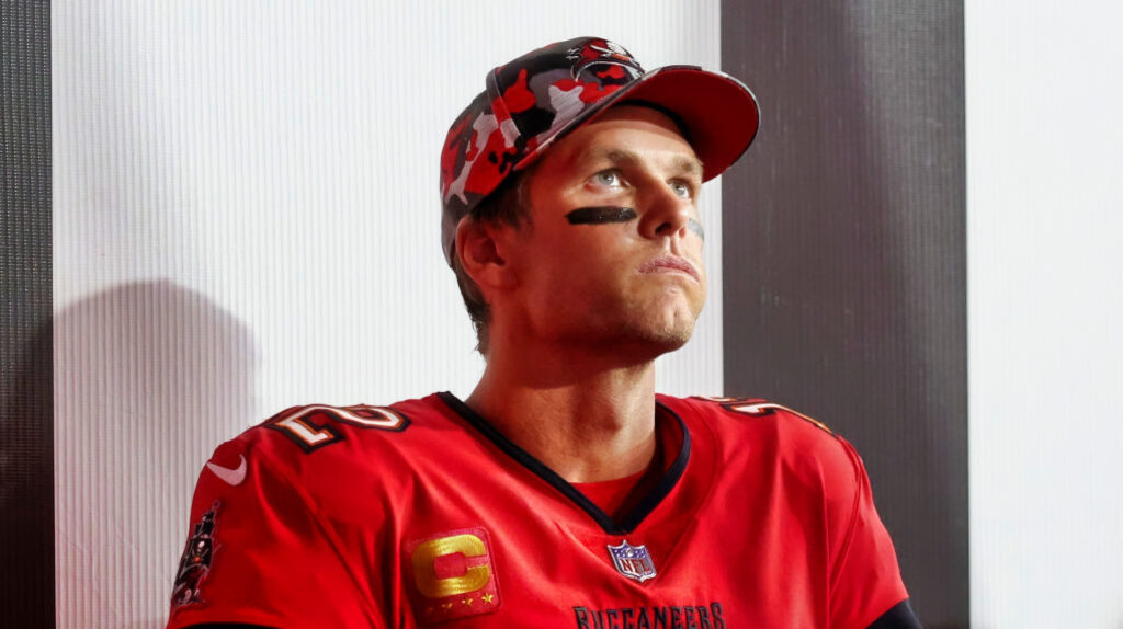 Tom Brady in uniform and looking up