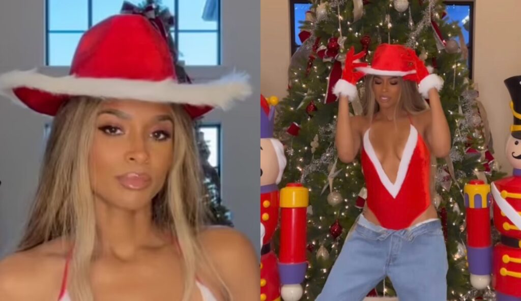 Ciara dressed in Christmas colors and standing in front of a Christmas tree