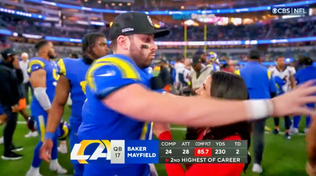 Baker Mayfield protects Tracey Wolfson during their postgame interview