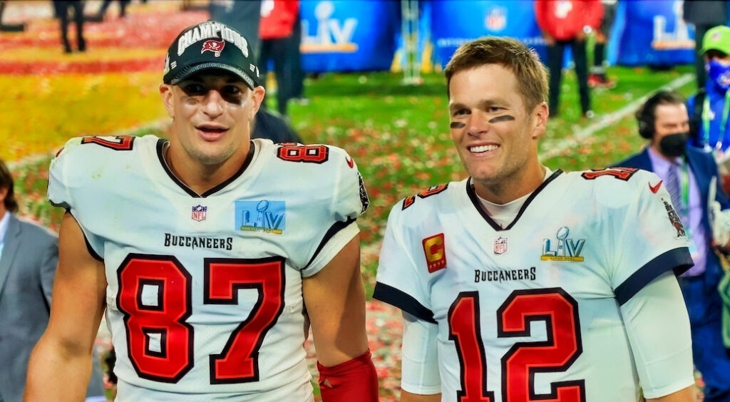 Rob Gronkowski and Tom Brady celebrating after leading Tampa Bay Buccaneers to Super Bowl 55 championship.