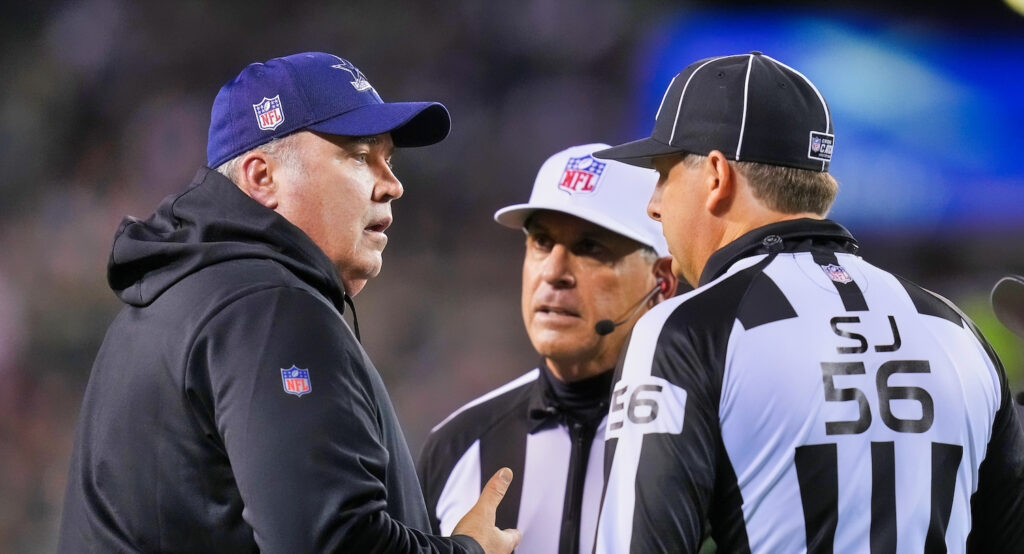Dallas Cowboys head coach Mike McCarthy speaking to referees during game against Philadelphia Eagles.