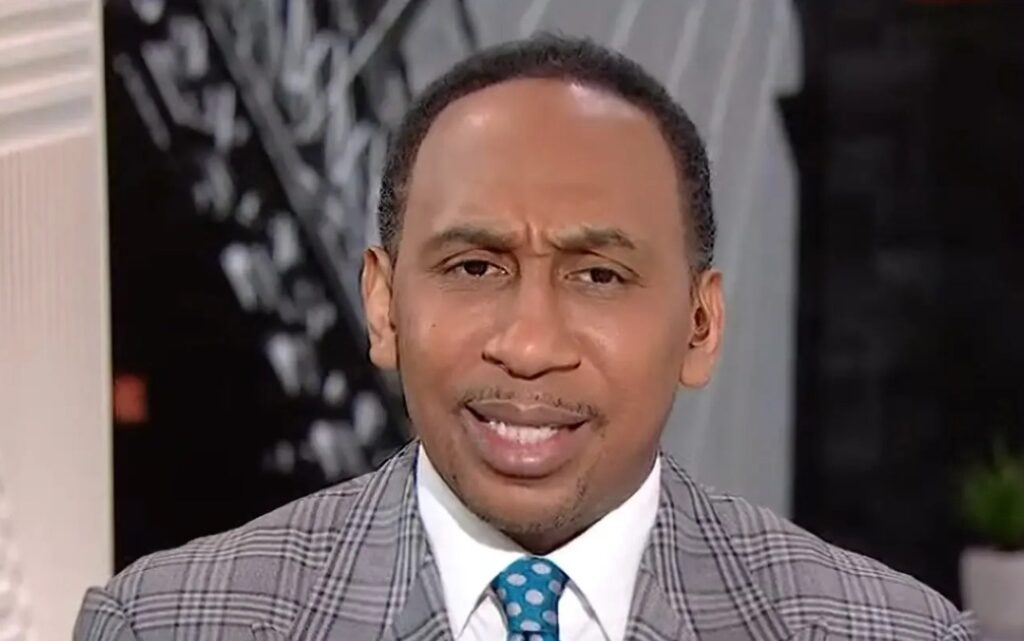 Stephen A. Smith in a suit and looking forward