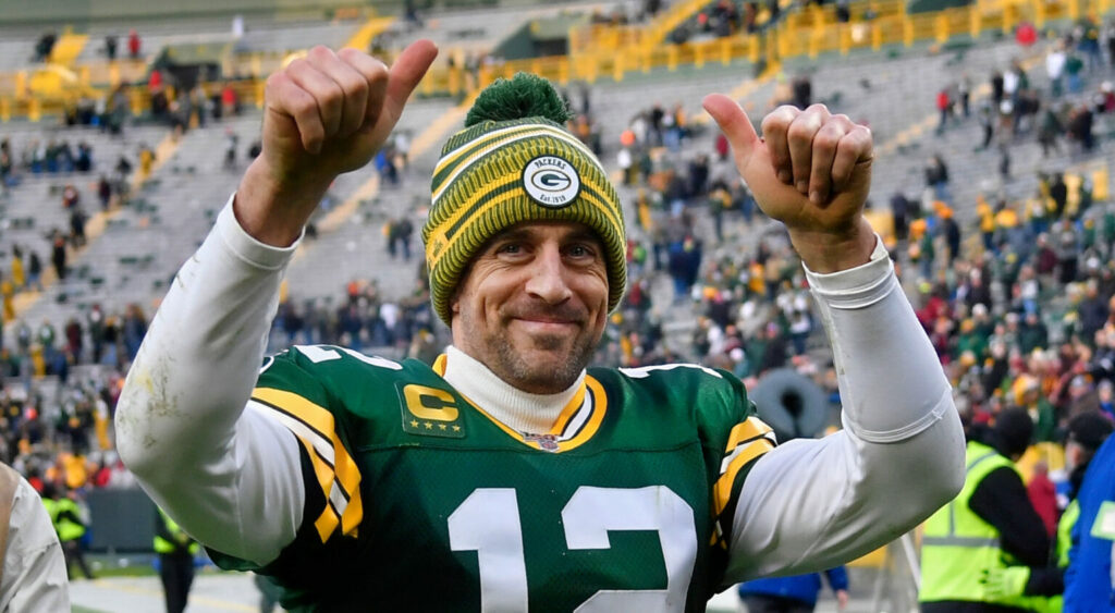 Green Bay Packers quarterback Aaron Rodgers celebrating a win at Lambeau Field.