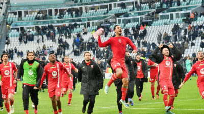 Monza players celebrate after beating Juventus