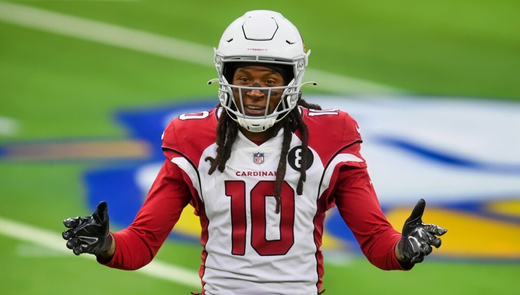 DeAndre Hopkins holds out his arms during a game.