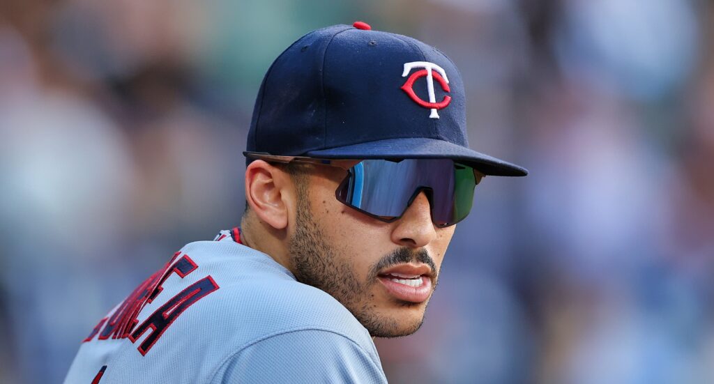 Carlos Correa in sunglasses and Twins cap