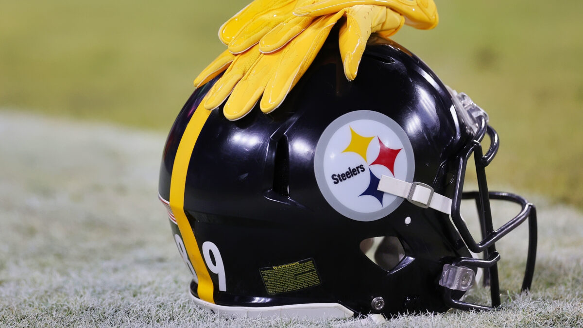 Gloves resting on Pittsburgh Steelers helmet