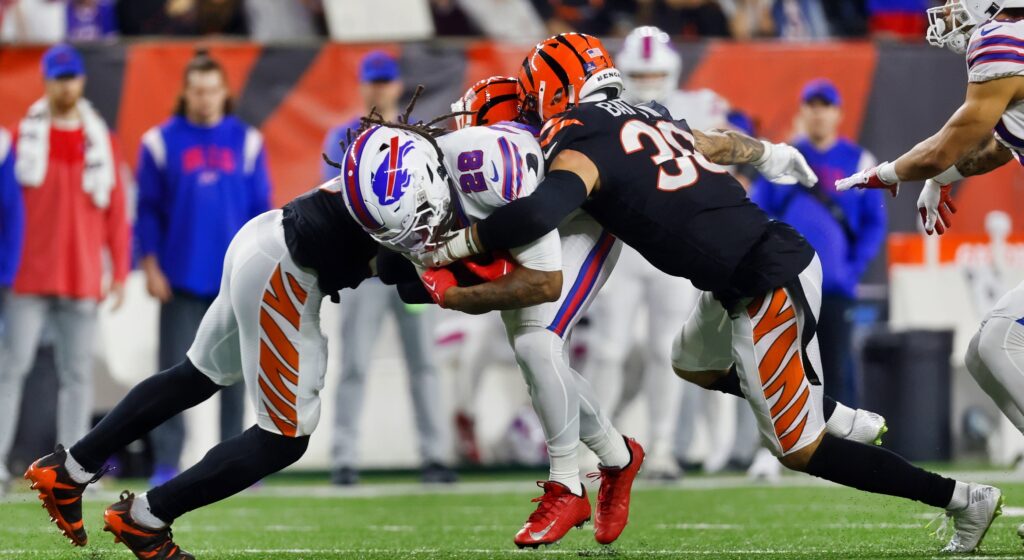 Bills player being tackled by Bengals players