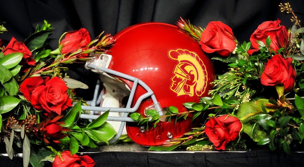 A USC helmet with roses around it.