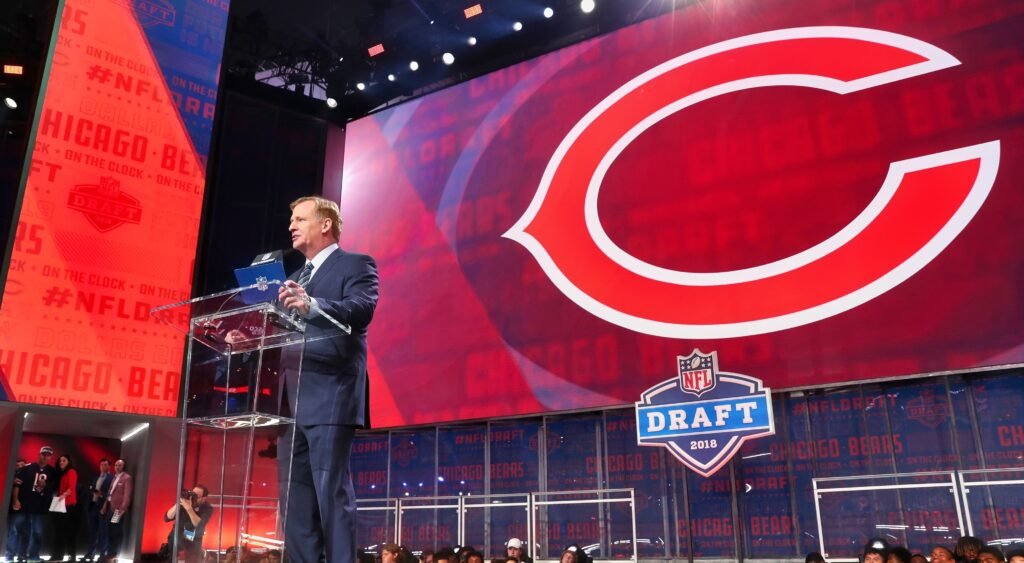 roger goodell at draft with Bears logo in the back