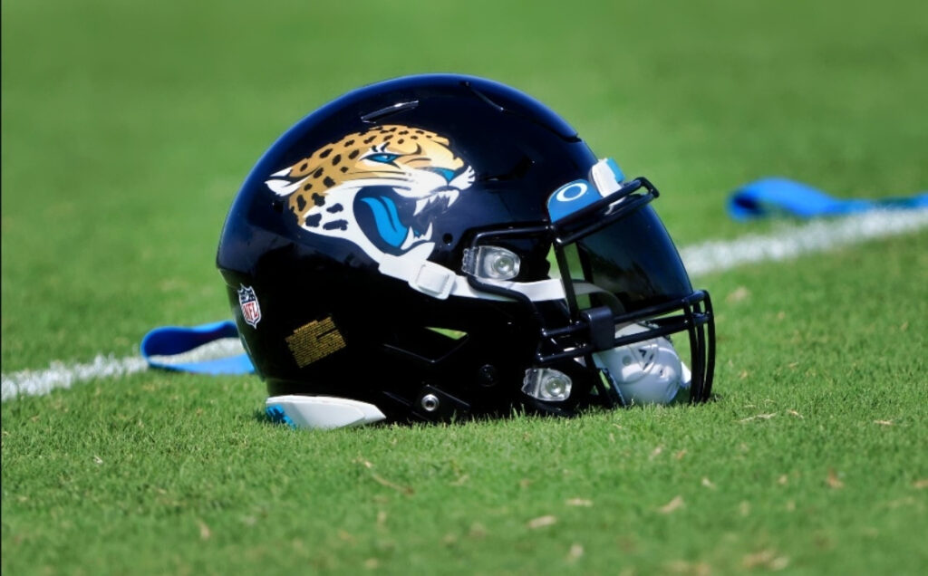 Jacksonville Jaguars helmet lying on the field during 2021 minicamp.
