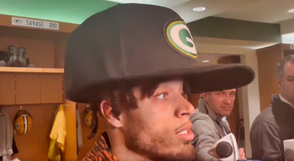 Jaire Alexander in locker room with big cap on head