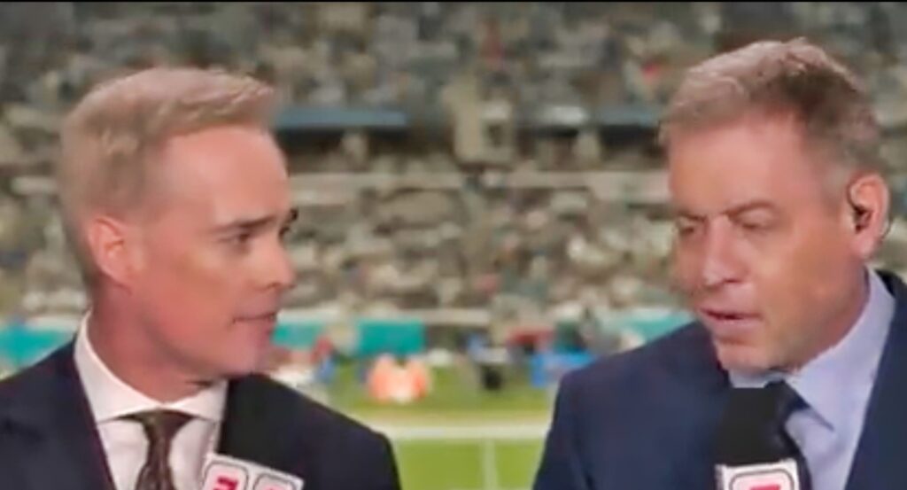 Troy Aikman and Joe Buck calling a game for ESPN.