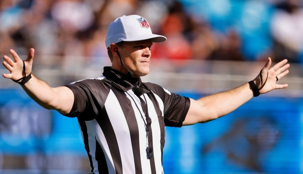 NFL referee Clay Martin making a call during 2022 Carolina Panthers-Denver Broncos game.