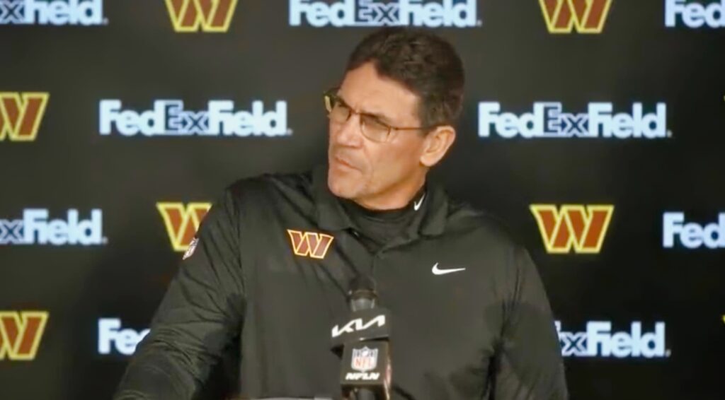 Ron Rivera with a confused look on his face during a press conference.