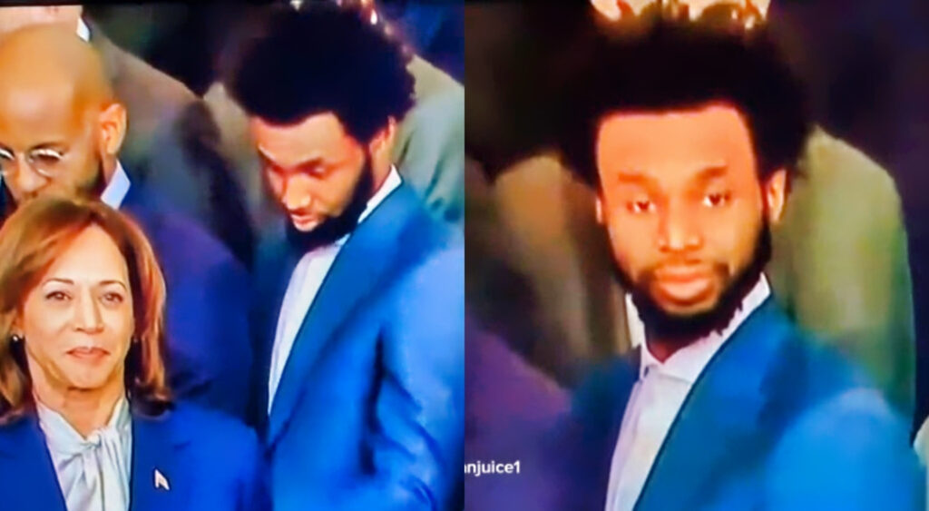 Andrew wiggins in suit looking down at Kamala Harris also in a suit.