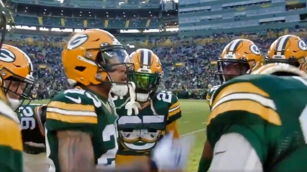 Packers player in huddle on field