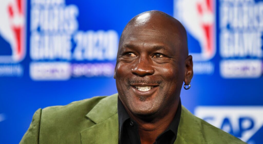 Michael Jordan smiles at a press conference.