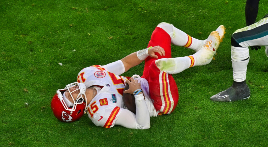 Patrick Mahomes lying on the ground in pain