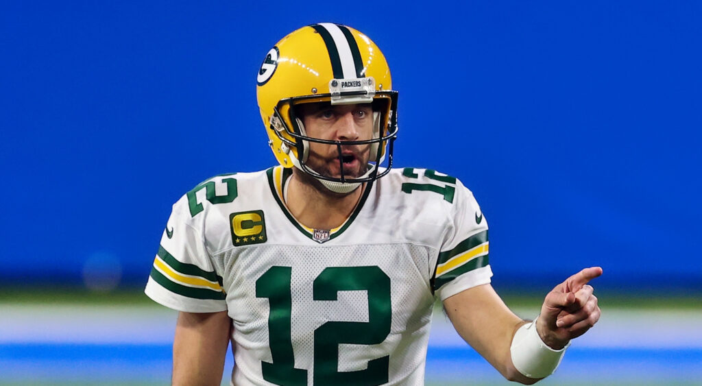 Aaron Rodgers in uniform and pointing