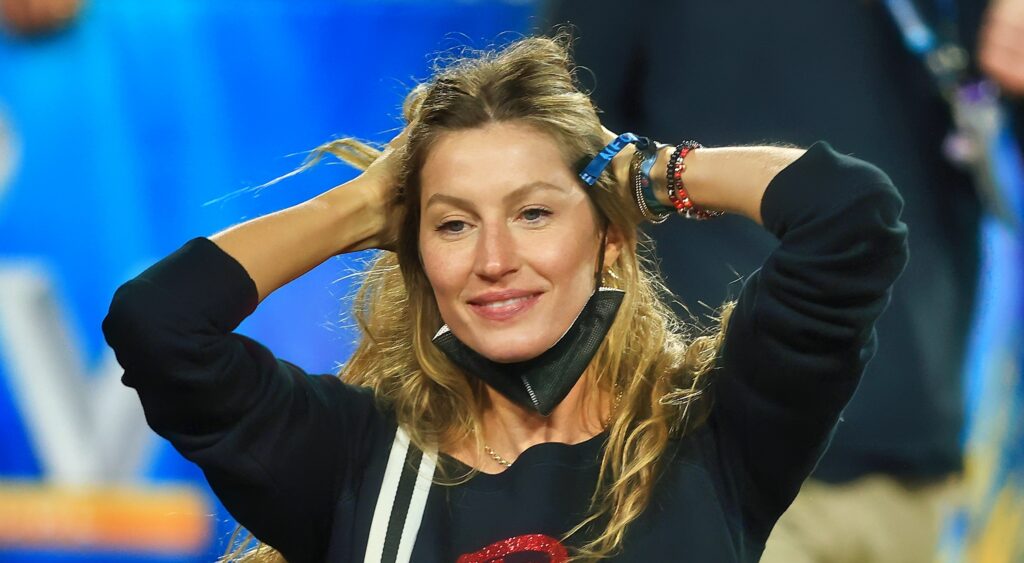 Gisele Bundchen with hands on her head