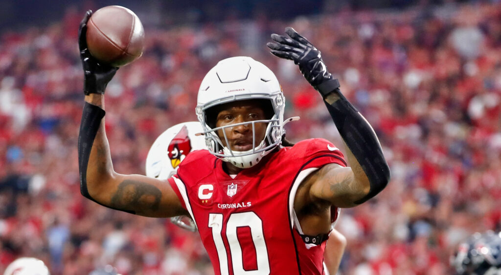 DeAndre Hopkins of Arizona Cardinals celebrating a touchdown in 2021 game.