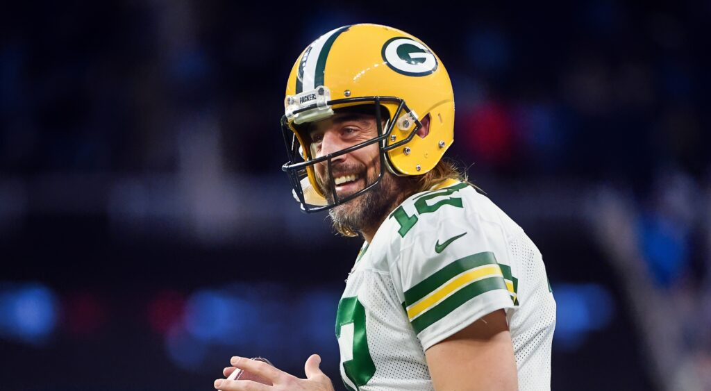Aaron Rodgers smiling while in uniform