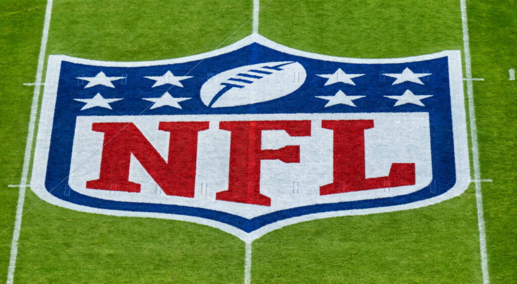 The NFL logo at midfield of Allianz Arena.