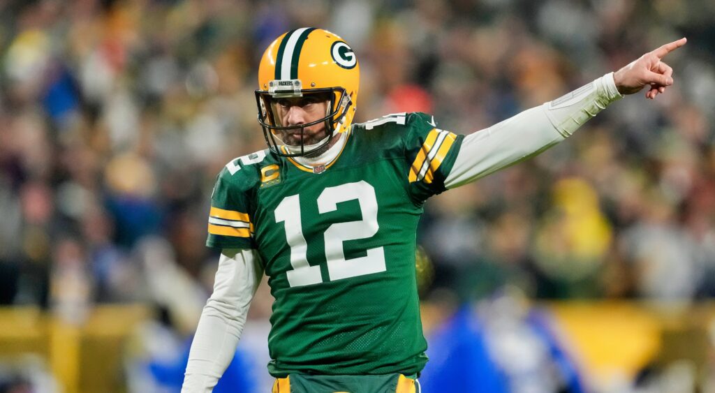 Aaron Rodgers points during a game.