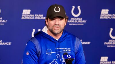 Jeff Saturday at podium in Colts hoodie