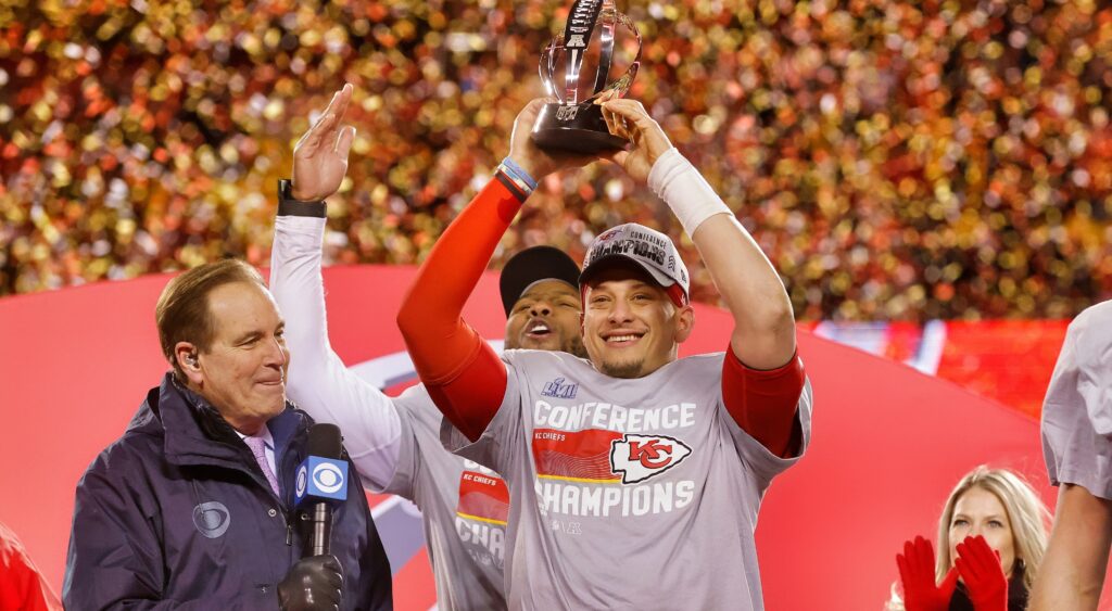 Patrick Mahomes holds up the AFC Championship trophy